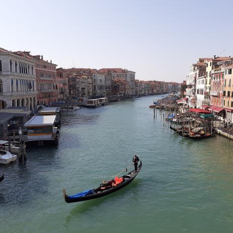 Rialto Bridge and a gondola in Venice, Italy