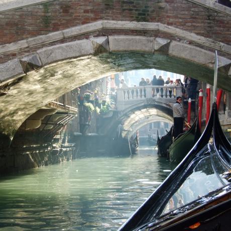 Gondolas along a canal in Venice, Italy